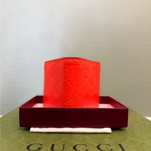 Gucci wallet in “bright orange”
